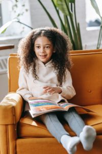 cute little girl reading a fairy tale